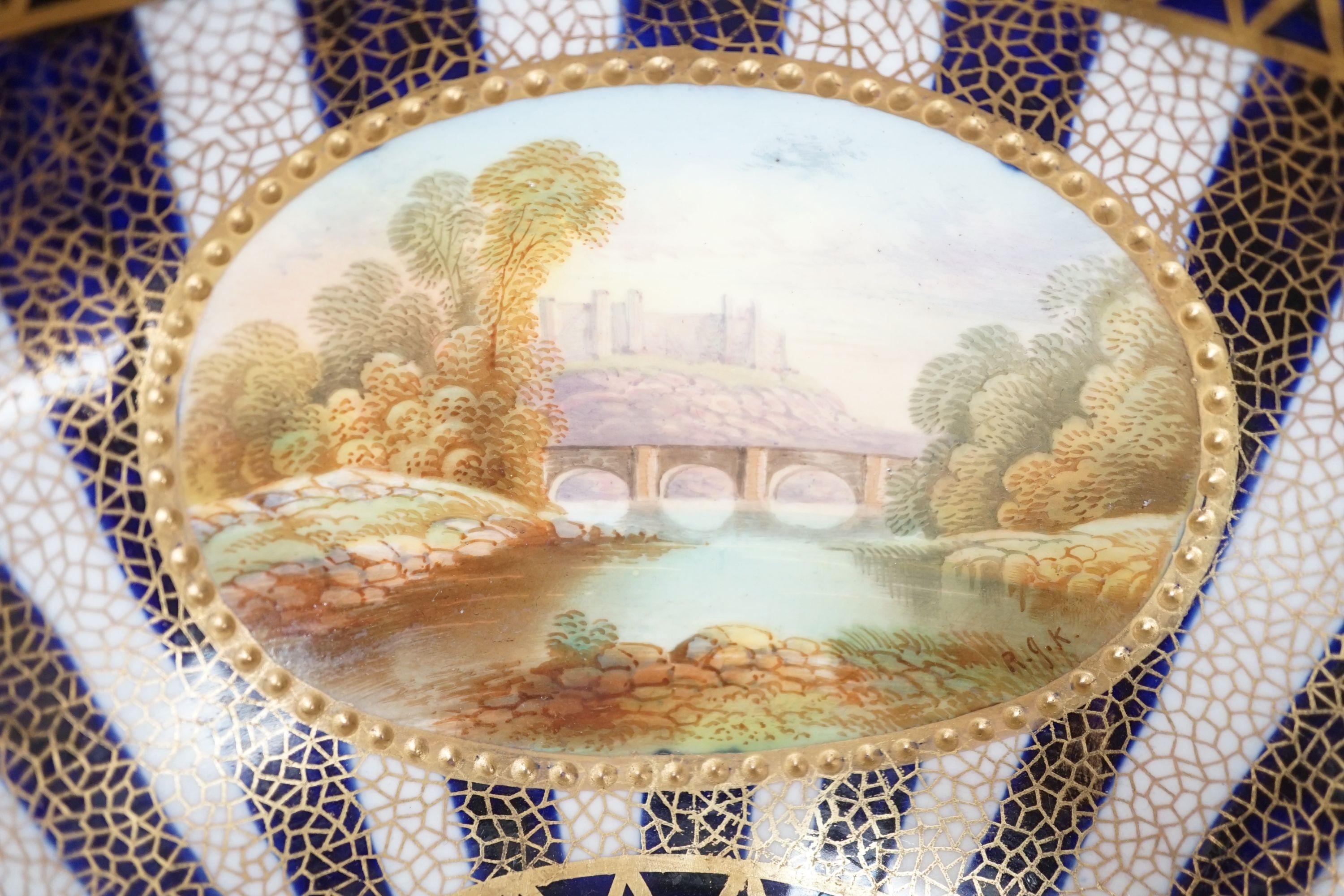 An Aynsley fine bowl with three interior landscape panels and three exterior panels painted with birds between alternating blue and white gilt stripes four panels signed R.J.K. for Richard J. Keeling, c.1910, height 10.5